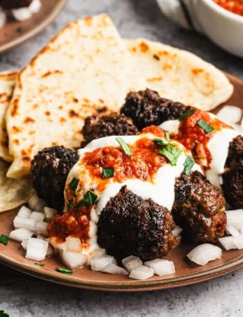 The best Cuban Sandwich recipe has layers of marinated pork, pickles, and swiss cheese. The flavor combination is unreal!