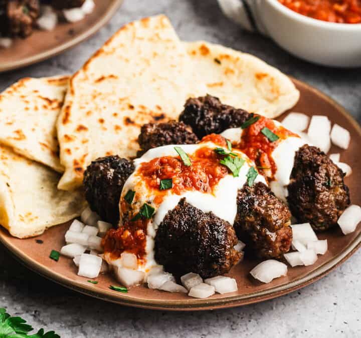 The best Cuban Sandwich recipe has layers of marinated pork, pickles, and swiss cheese. The flavor combination is unreal!