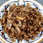 Italian painted bowl filled with deconstructed Portuguese sausage.