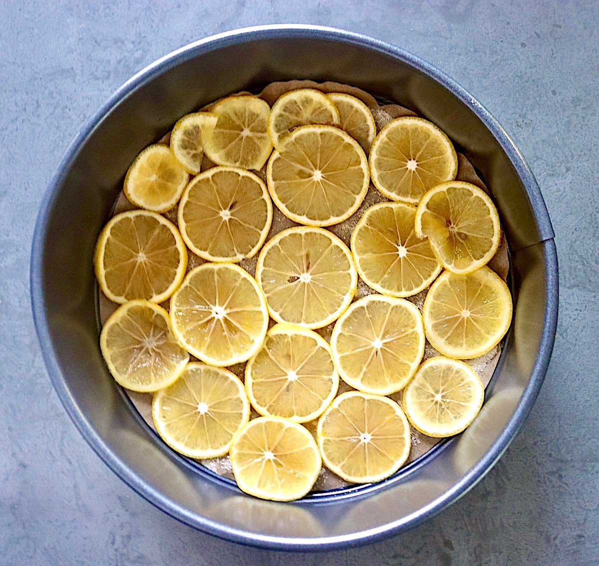 Lemon slice lined cake pan.