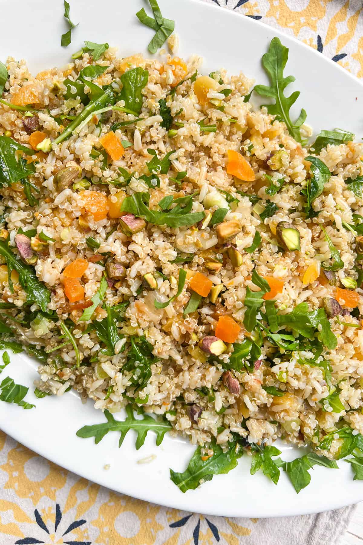 cooked brown rice and quinoa mixed with chopped arugula, dried apricots and pistachios.