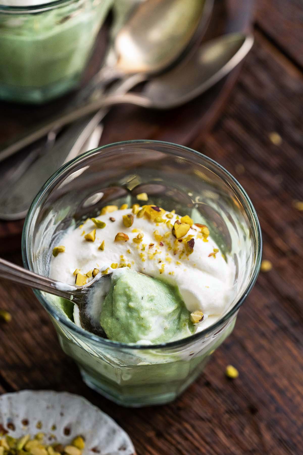 overhead view of partially eaten homemade pistachios pudding in cup