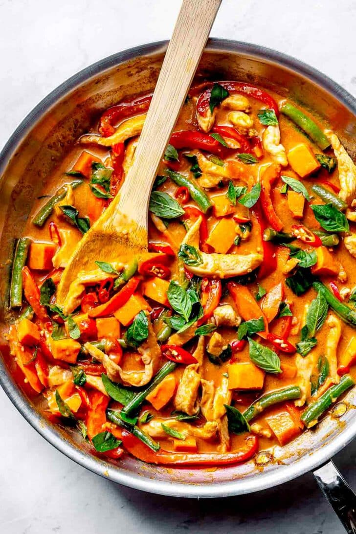 Thai Red Curry Chicken in a skillet with vegetables