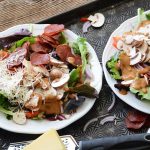 healthy loaded pizza salads with parmesan and pepperoni chips