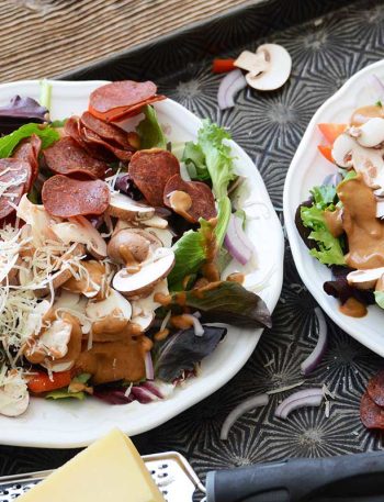 healthy loaded pizza salads with parmesan and pepperoni chips