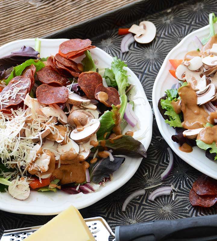 healthy loaded pizza salads with parmesan and pepperoni chips