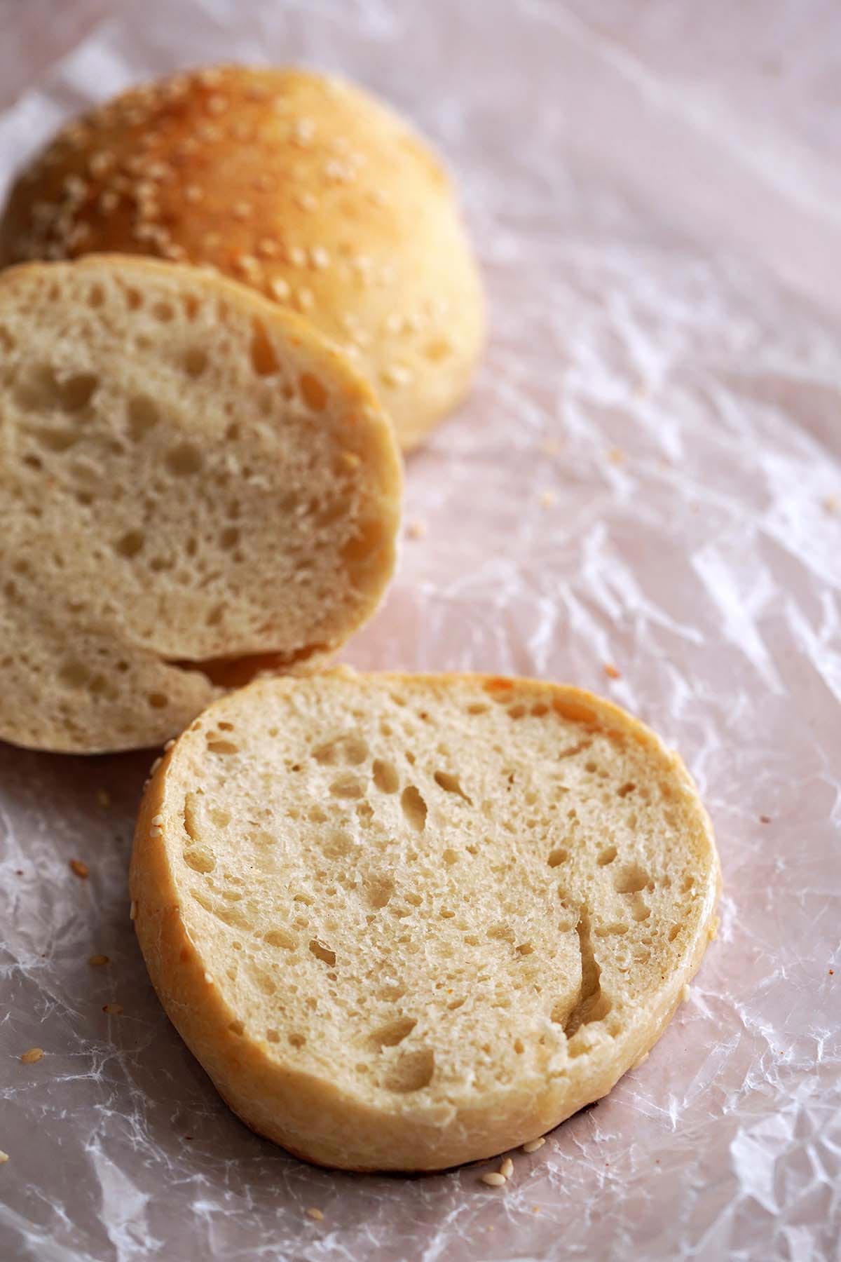soft and chewy sourdough sandwich rolls with sesame seeds