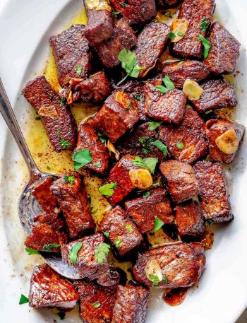 Steak Bites on platter with spoon