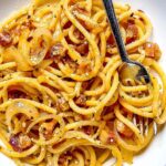 Chili Crisp Carbonara in a bowl with a fork