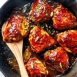 Filipino Chicken Adobo recipe in a skillet with a spoon