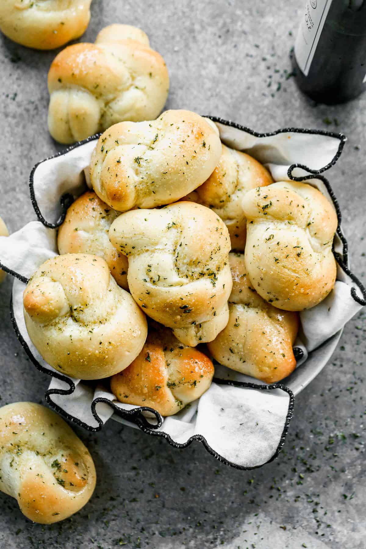 This recipe for homemade Garlic Knots is soft, fluffy, and brushed with delicious garlic butter. It's easy to make with pantry staples and disappears in minutes!